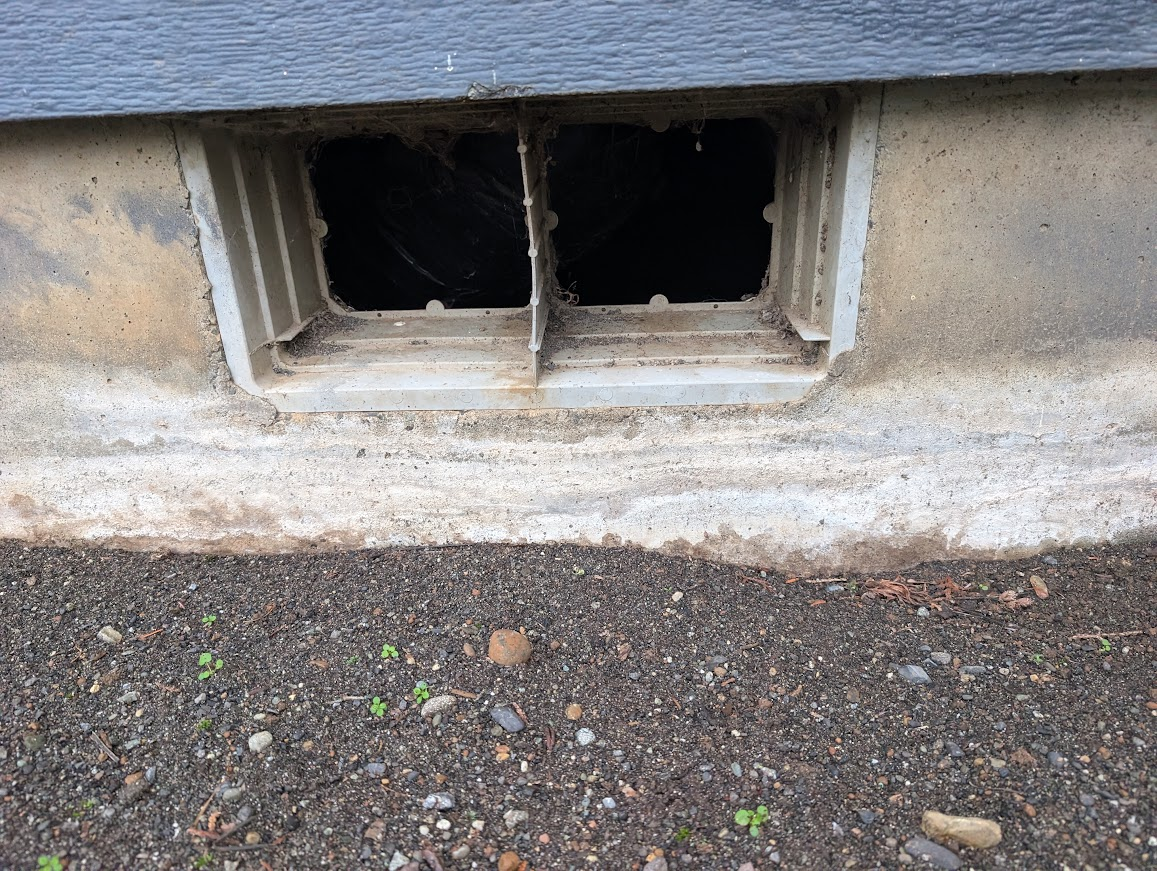 Crawl space vent with no screen at all, leaving two open holes into the crawl space, North Bellingham